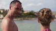 Happy couple talking by the sea, super slow motion