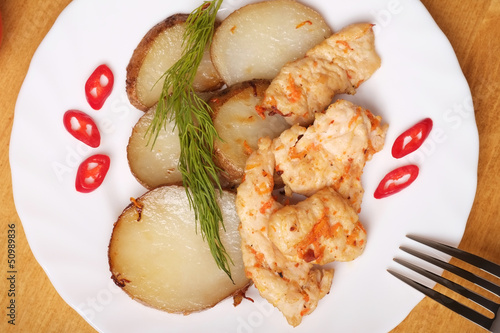 Photo: Potato slices with chicken - Top view Potato slices with chicken - Top view