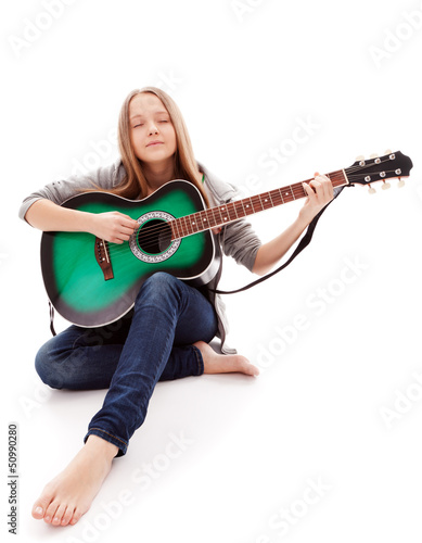 Photo: Beautiful girl with guitar on white background Beautiful girl with guitar on white background