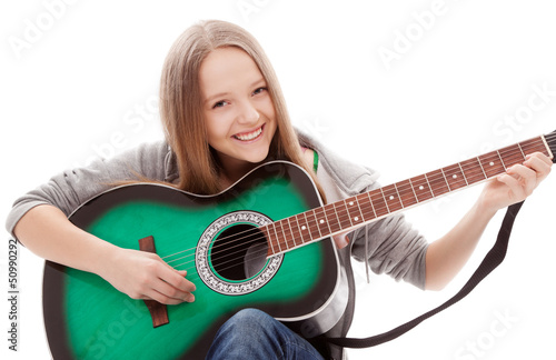 Photo: Beautiful girl with guitar on white background Beautiful girl with guitar on white background