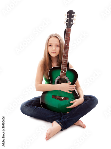 Photo: Beautiful girl with guitar on white background Beautiful girl with guitar on white background