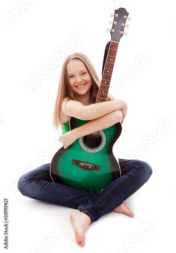 Photo: Beautiful girl with guitar on white background Beautiful girl with guitar on white background