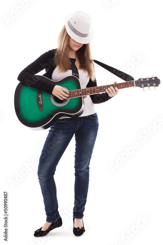 Photo: .Beautiful girl with guitar on white background .Beautiful girl with guitar on white background