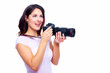 Foto: Woman with a photocamera. Woman with a photocamera.