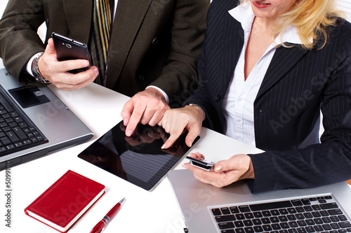 Photo: Business people group working with laptop. Business people group working with laptop.