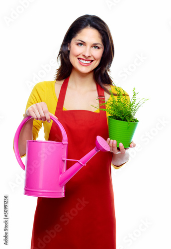 Photo: Gardening woman with plant. Gardening woman with plant.