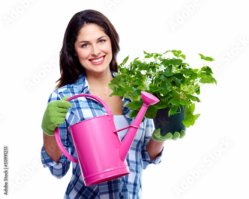 Photo: Gardening woman with plant. Gardening woman with plant.