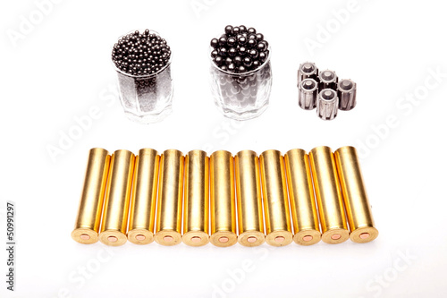 Photo: shot and hunting cartridges on a white background shot and hunting cartridges on a white background
