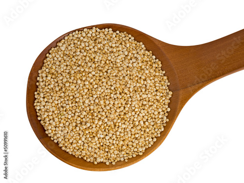 Photo: Quinoa on wooden spoon isolated over white background Quinoa on wooden spoon isolated over white background