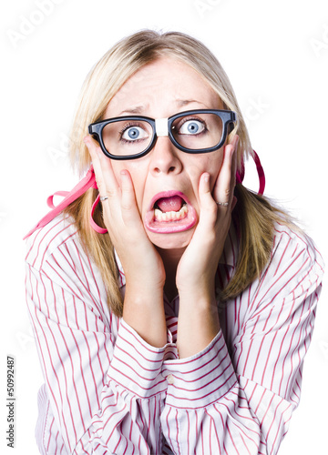 Photo: Nerdy woman reacting in horror and fright Nerdy woman reacting in horror and fright