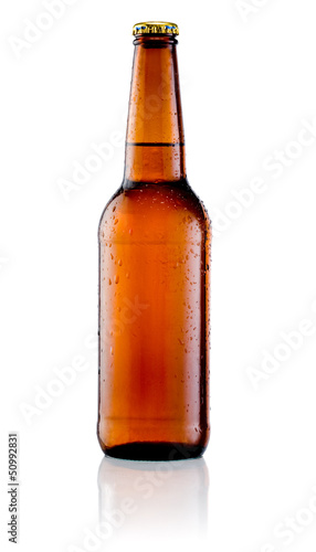 Photo: Brown bottle of beer with drops on a white background Brown bottle of beer with drops on a white background