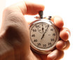 Male hand holding stopwatch