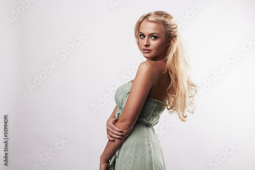 Photo: Beautiful cute blond woman in dress Beautiful cute blond woman in dress