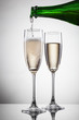 Foto: Champagne pouring into glass isolated on white Champagne pouring into glass isolated on white