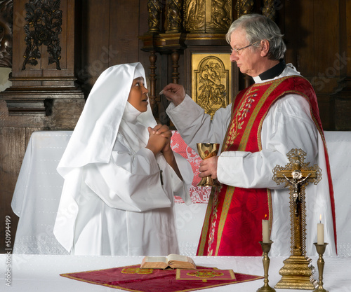 Photo: Communion and nun Communion and nun