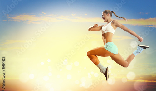 Photo: Image of sport woman jumping Image of sport woman jumping