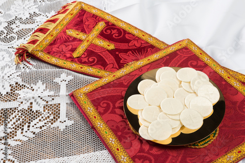 Photo: Communion hosts or wafers and vestment Communion hosts or wafers and vestment