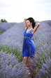 Photo: Woman standing on a lavender field Woman standing on a lavender field