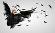 Woman floating   on dark wings