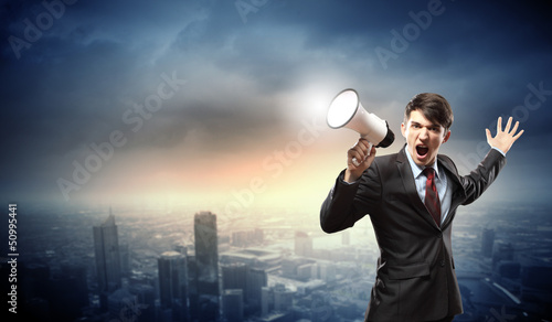 Photo: businessman with megaphone businessman with megaphone