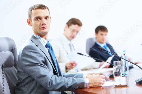 Photo: Three businesspeople at meeting Three businesspeople at meeting