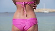 Woman touching her body by the sea, super slow motion
