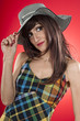 beautiful girl with hat posing in studio
