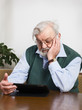 Senior using digital tablet