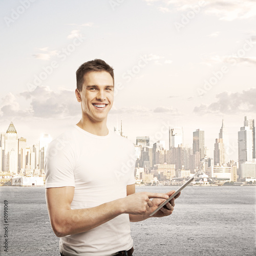 Photo: man holding tablet man holding tablet