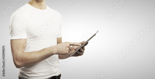 Photo: man holding tablet man holding tablet