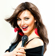 Beautiful Singing Girl. Beauty Woman with Microphone over White