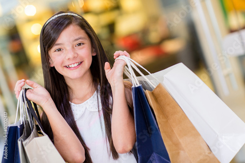 Photo: Girl holding shopping bags Girl holding shopping bags
