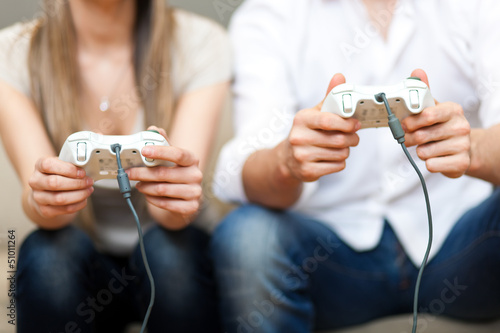 Photo: Couple playing at videogames Couple playing at videogames