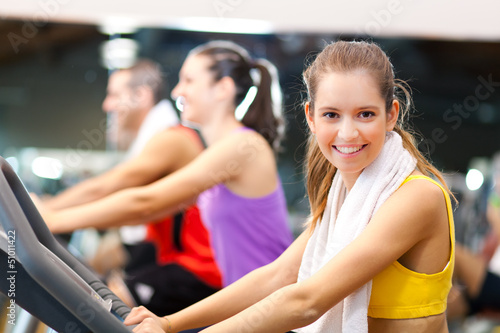 Photo: Young people running on a treadmill Young people running on a treadmill