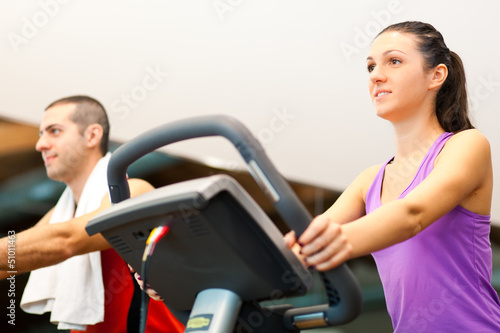 Photo: People running on a treadmill People running on a treadmill