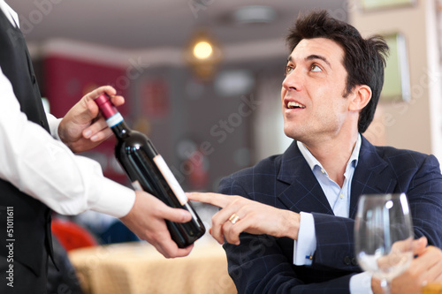 Photo: Man talking with waiter Man talking with waiter