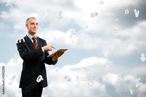Photo: business man is working with tablet business man is working with tablet
