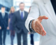 A business man with an open hand ready to seal a deal