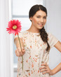 young and beautiful woman with flower