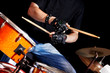 Woman playing  drum .