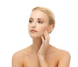 woman touching her face skin