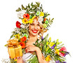 Woman with gift box and flower.
