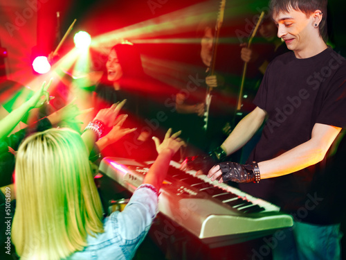 Photo: Band playing musical instrument. Band playing musical instrument.