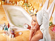 Woman applying moisturizer.