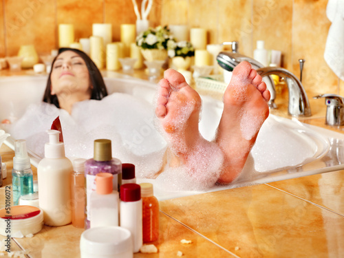 Photo: Woman relaxing at bubble bath. Woman relaxing at bubble bath.