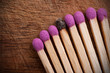 Group of matchsticks and a used one.