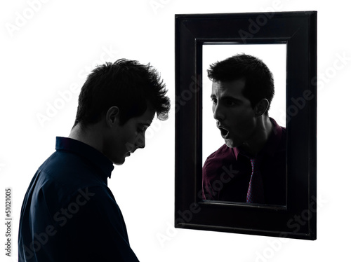 Photo: man in front of his mirror silhouette man in front of his mirror silhouette