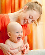 Photo: Mother and son play in the bedroom Mother and son play in the bedroom