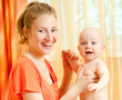 Photo: Mother and son play in the bedroom Mother and son play in the bedroom