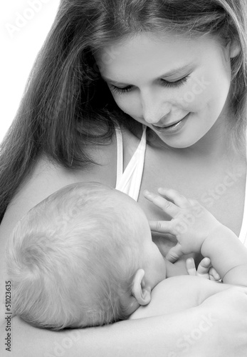 Photo: Mother breast feeding her infant Mother breast feeding her infant